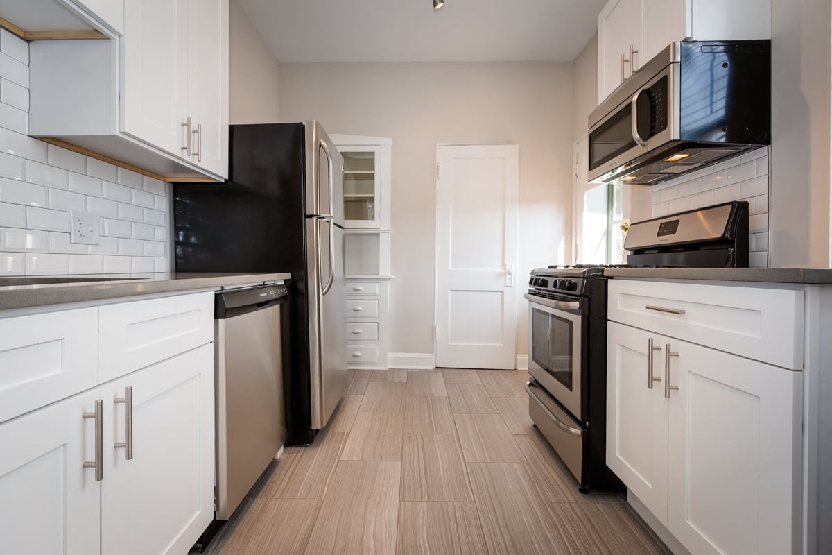 renovated kitchen stainless steel appliances vintage apartment chicago hyde park apartment
